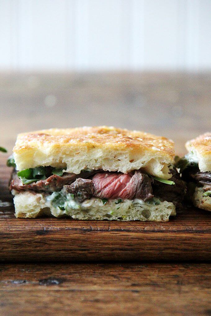 In these skirt steak sandwiches, skirt steak, which cooks to medium-rare in just about 5 minutes, is layered with arugula between slices of focaccia smeared with herbed mayonnaise. The key, as with all meats, is to let the steak rest for at least 10 minutes before slicing, and with skirt steak, to slice it thinly against the grain. // alexandracooks.com In these skirt steak sandwiches, skirt steak, which cooks to medium-rare in just about 5 minutes, is layered with arugula between slices of focaccia smeared with herbed mayonnaise. The key, as with all meats, is to let the steak rest for at least 10 minutes before slicing, and with skirt steak, to slice it thinly against the grain. // alexandracooks.com