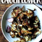 A bowl of roasted cauliflower with garlic and parmesan.