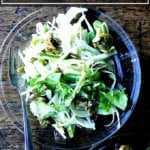 A festive fall salad on a plate.