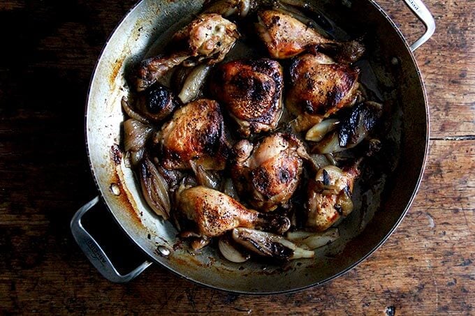 A pan of roast chicken and shallots.