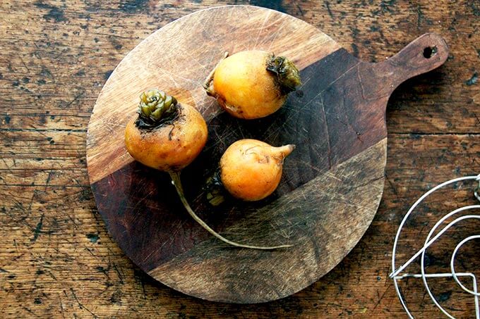 Cooked beets on a board.