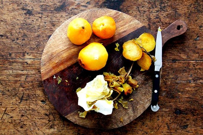 Cooked, peeled beets on a board.