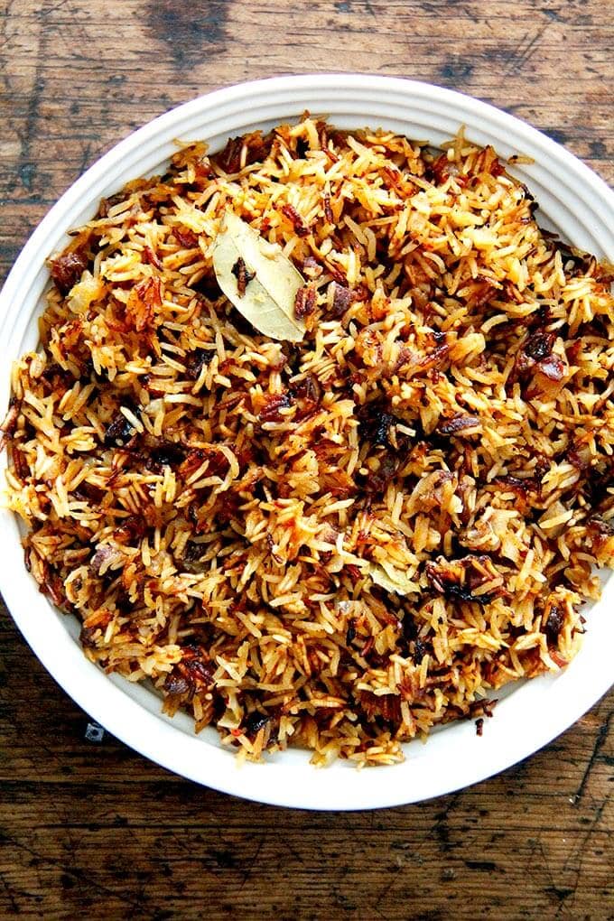 A bowl of Moroccan Rice with dates and orange.