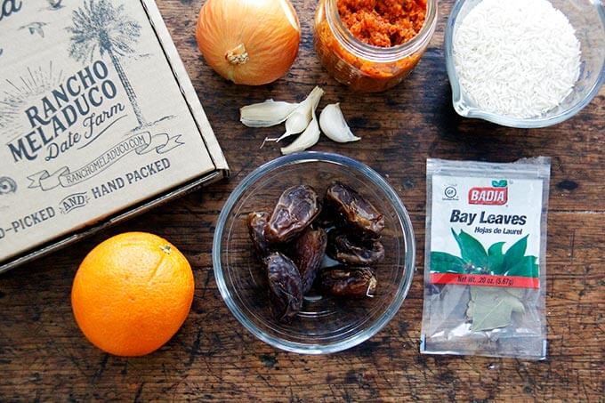 Ingredients to make Moroccan rice on a board.