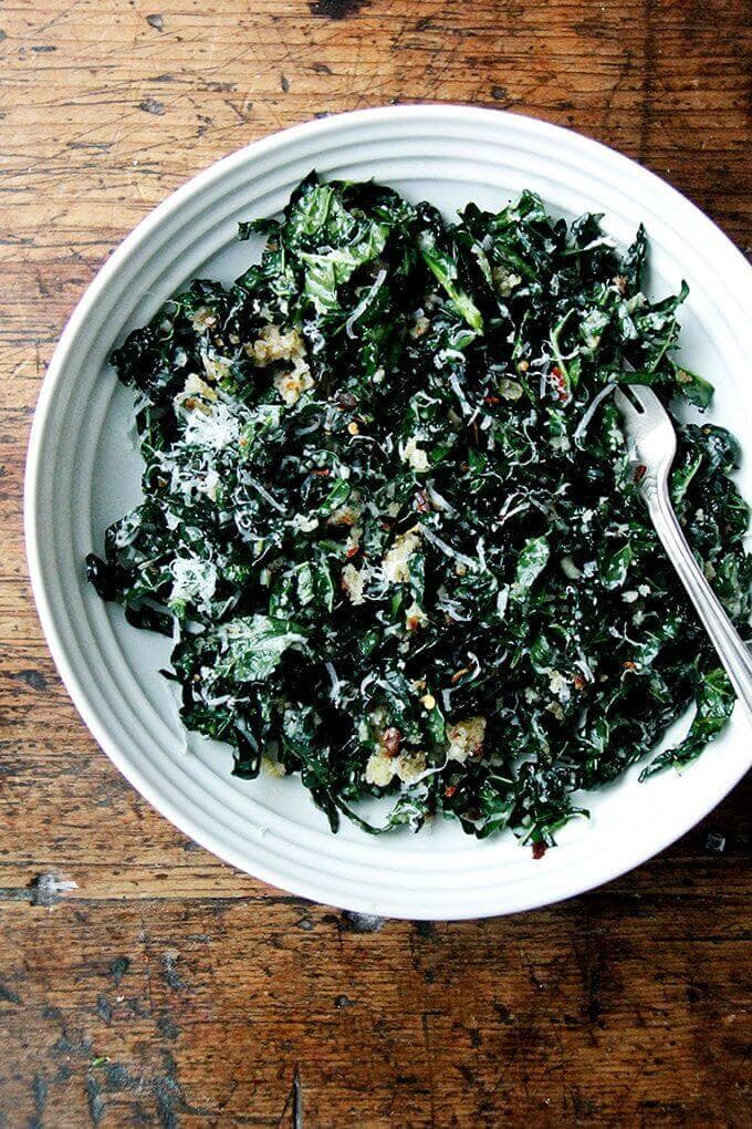A bowl of kale salad with shallot vinaigrette.