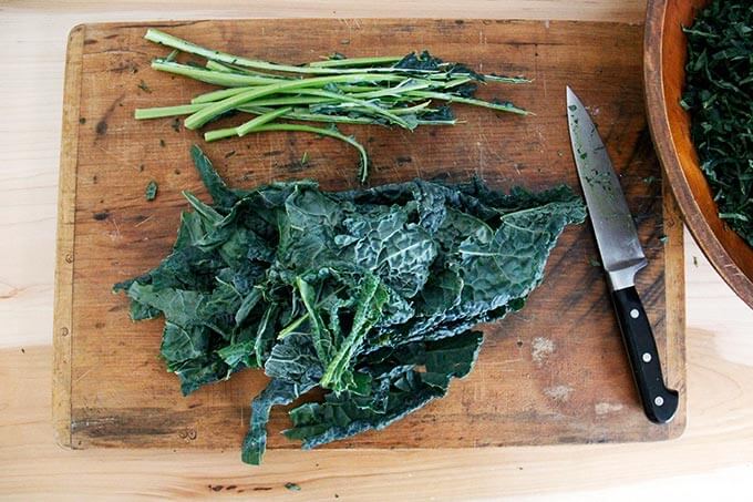 Removing the kale leaves from the stems.