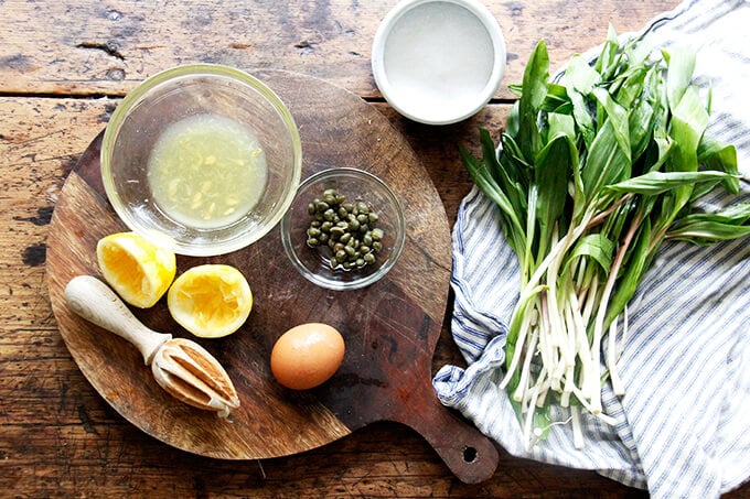 A board with the ingredients to make homemade aioli.
