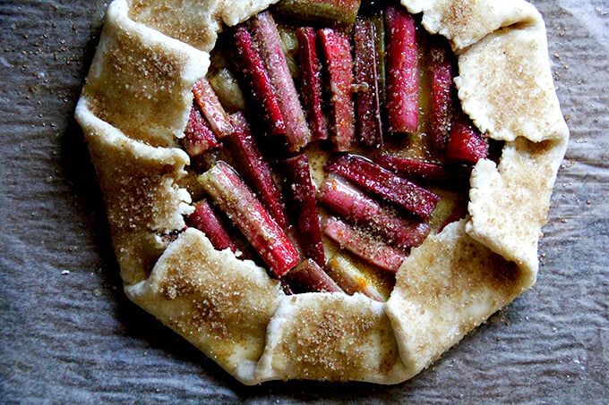 Galette on a sheet pan, brushed with egg wash, sprinkled with sugar.