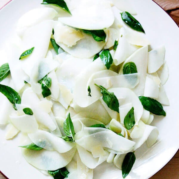 A platter of shaved Kohlrabi Salad with basil and parmesan.
