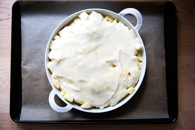 Cobbler ready for the oven on a sheet pan.