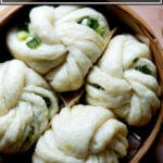 A steamer filled with Chinese steamed scallion buns.