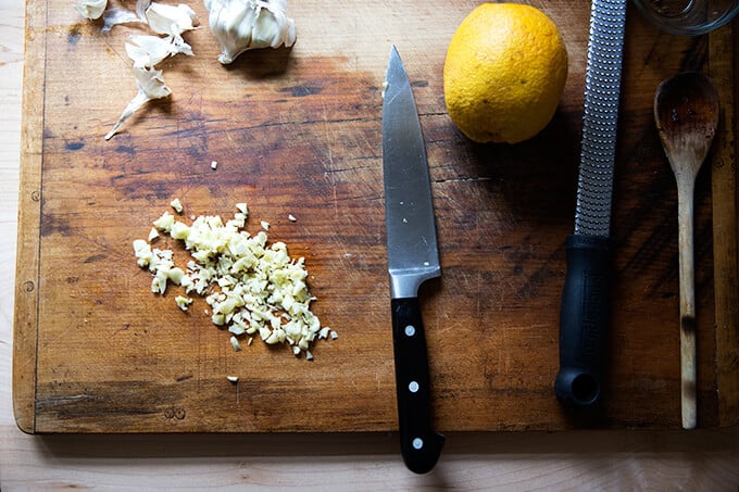 Minced garlic on a board.