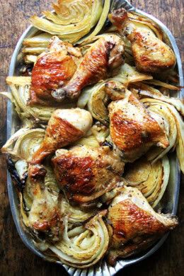 A platter of sheet pan chicken and cabbage.