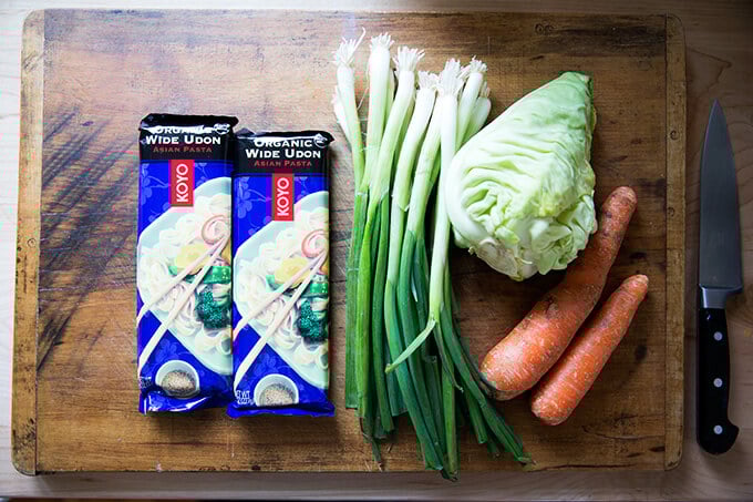 How to make Chinese noodles with chilies, scallions, and cabbage.