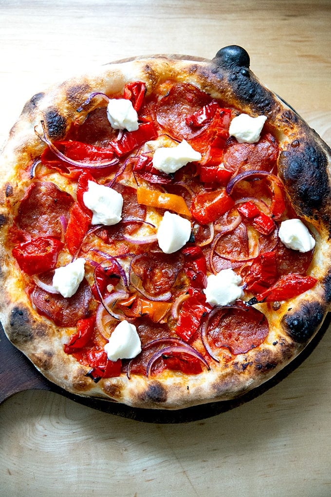 Homemade pizza topped with homemade ricotta.