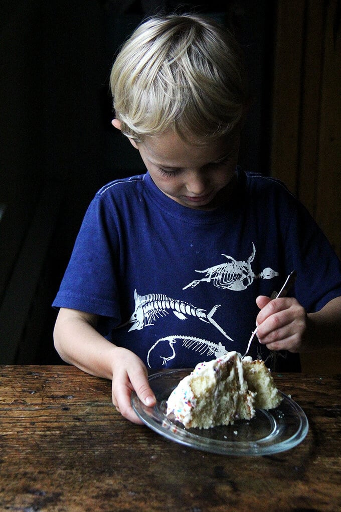 birthday boy eating one-bowl buttermilk birthday cake.