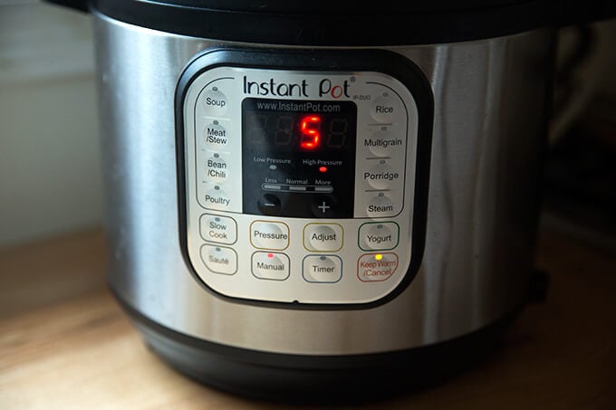 The Instant Pot set to manual, high pressure for 5 minutes, the settings for perfect hard-boiled eggs every time.
