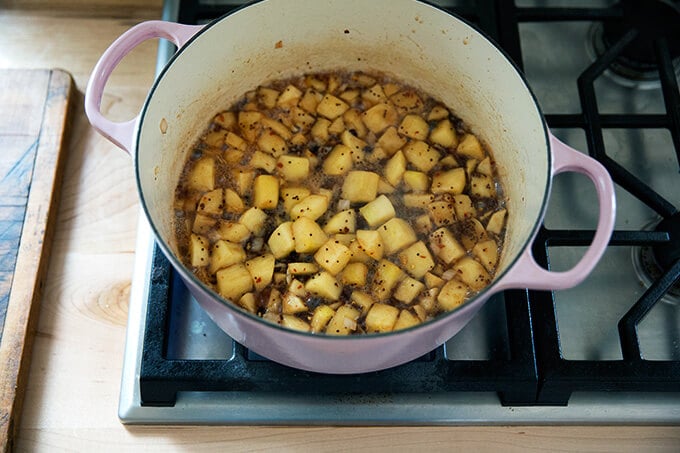 Apple chutney ingredients in a pot simmering.