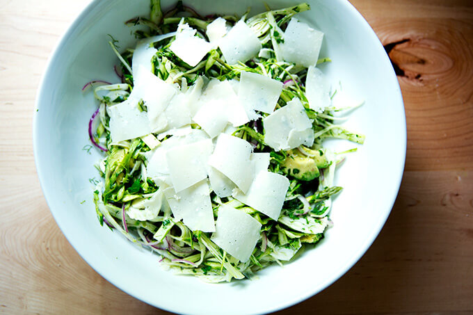 Adding the shaved parm to the shaved fennel salad.