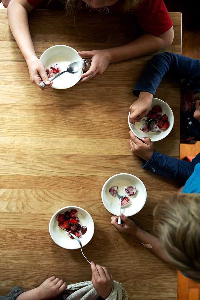 My 4 children eating strawberries + cream
