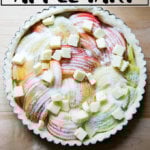 An overhead shot of an unbaked French apple tart.