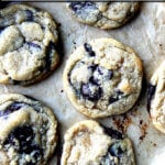 A sheet pan of freshly baked chocolate chip cookies.