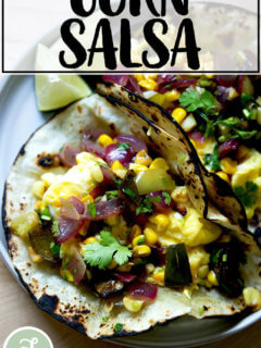 A plate of breakfast tacos with corn salsa.