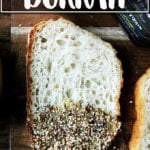 A board with bread dipped in olive oil and dukkah.