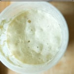 An overhead shot of a bubbly sourdough starter.