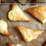 A sheet pan with just-roasted tiropitas.