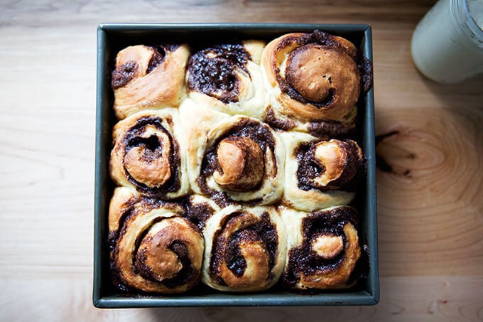 Just baked brioche cinnamon buns in square baking dish.