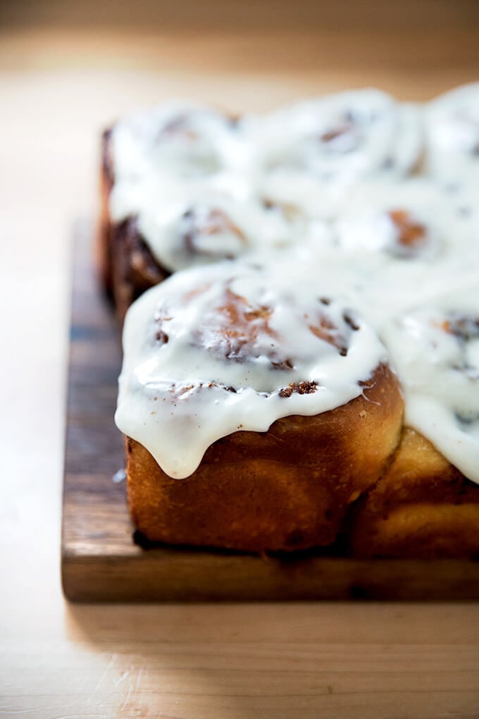 A brioche cinnamon bun, frosted.