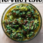 An overhead shot of a bowl holding sun dried-tomato pesto.