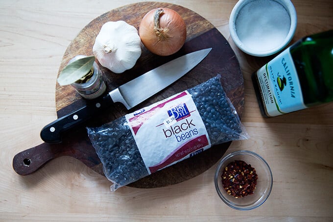 Ingredients for slow cooker black beans on a board.