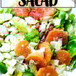 A platter topped with an endive, grapefruit and avocado salad, finished with shavings of parmesan.