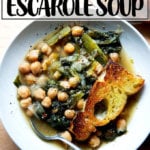 A bowl of chickpea and escarole soup with toasty bread.