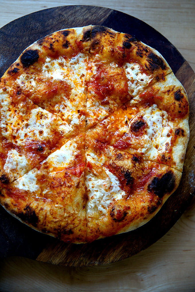 Just baked sourdough pizza crust cut into slices.