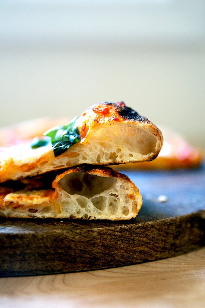 Two crumb shots of sourdough pizza crusts, freshly baked.