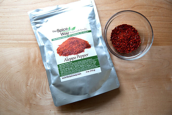 A bag of Aleppo Pepper aside a bowl of Aleppo pepper.