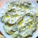 A platter smeared with tzatziki.