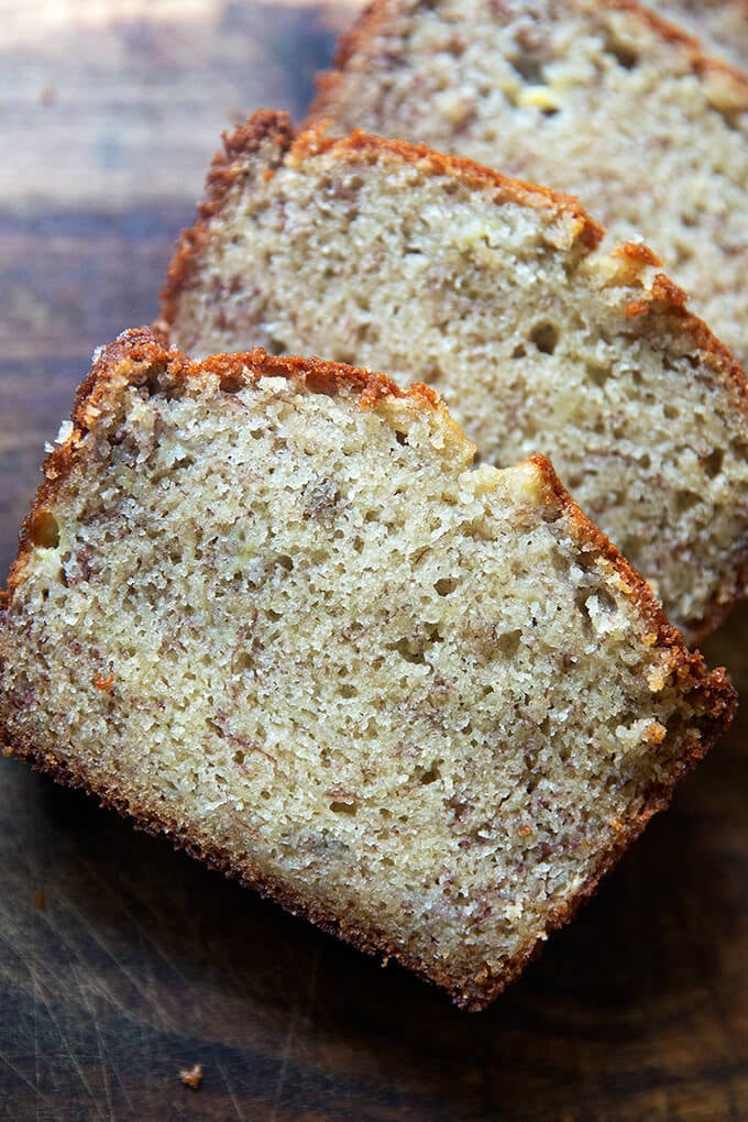 Slied banana bread on a board.