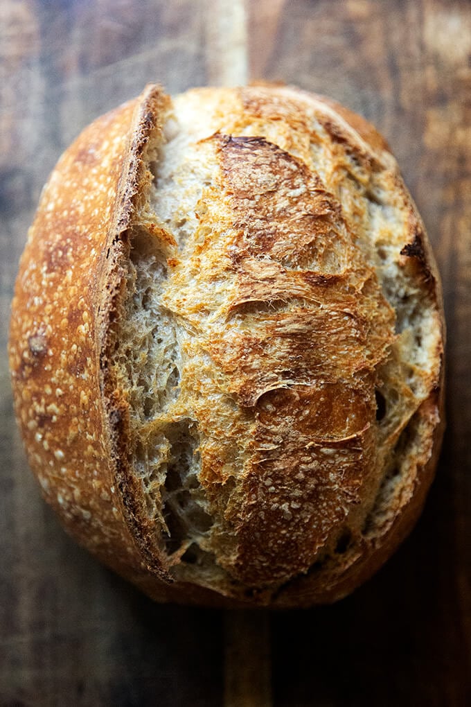 A loaf of baked sourdough bread.