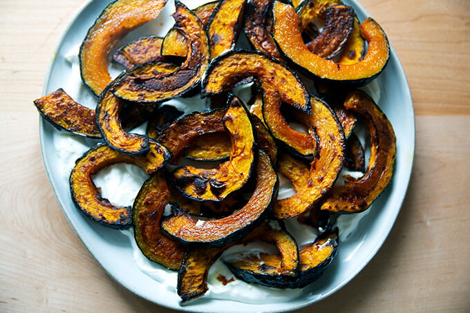 Roasted Kabocha squash atop lemony yogurt sauce.