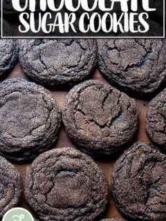 Baked chocolate sugar cookies on a board.