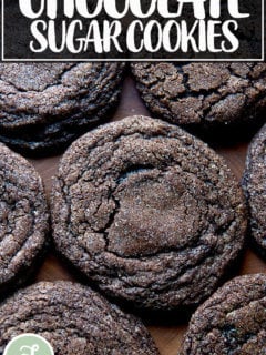 Baked chocolate sugar cookies on a board.