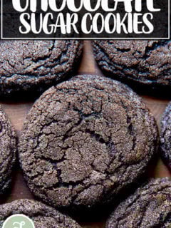 Baked chocolate sugar cookies on a board.