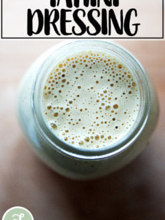 A large jar of tahini salad dressing.