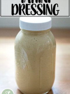 A large jar of tahini salad dressing.