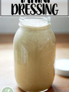 A large jar of tahini salad dressing.