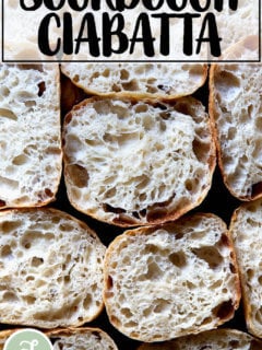 Halved sourdough ciabatta rolls on a countertop.